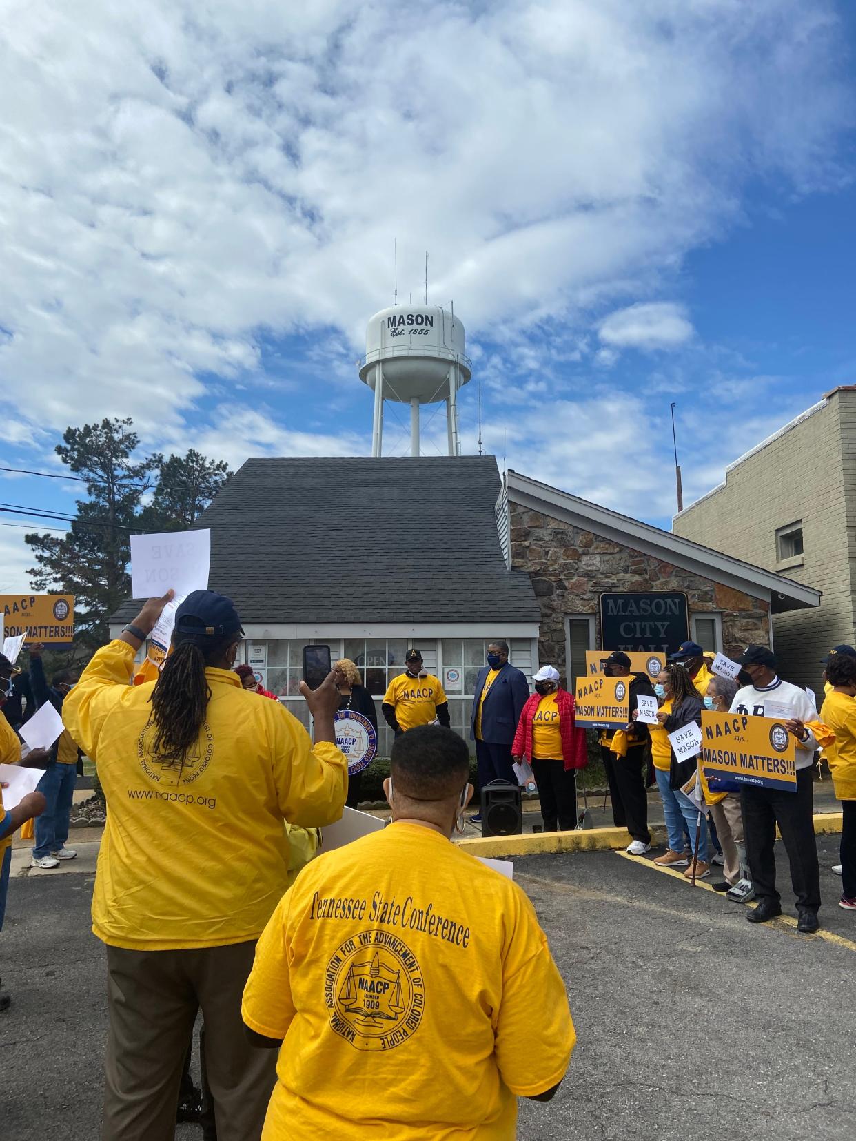 Cloudy skies begin to clear above Mason Town Hall on April 2, 2022, as the Tennessee NAACP has a rally in front of the building.