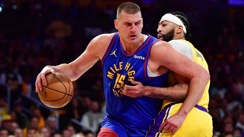 Jokić battles Davis in a duel between two star big men. - Gary A. Vasquez/USA TODAY Sports/Reuters