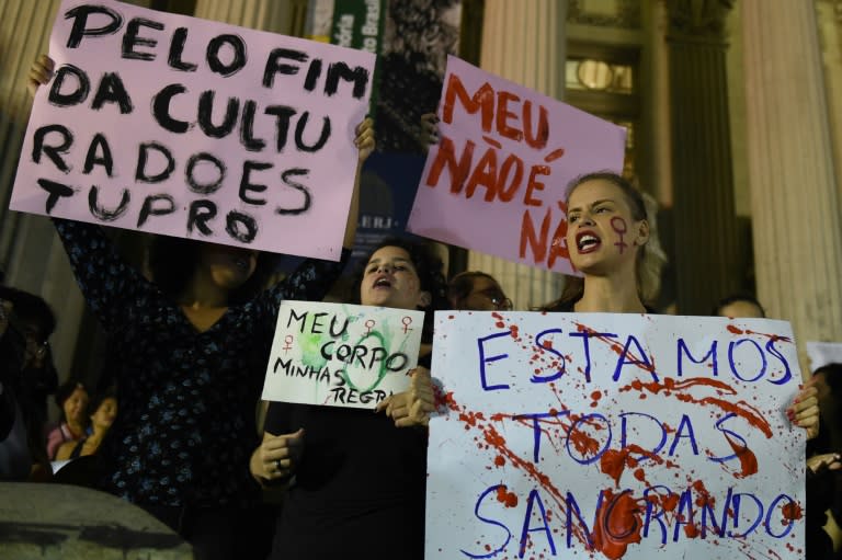 Brazilians protest in front of the Legislative Assembly of Rio de Janeiro on May 27, 2016, against a gang-rape of a 16-year-old girl