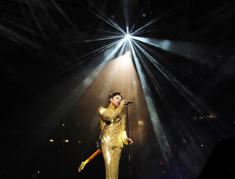 Prince performing on stage. The late trailblazer was best known for '80s chart-toppers including "Let's Go Crazy," "Kiss" and "When Doves Cry."