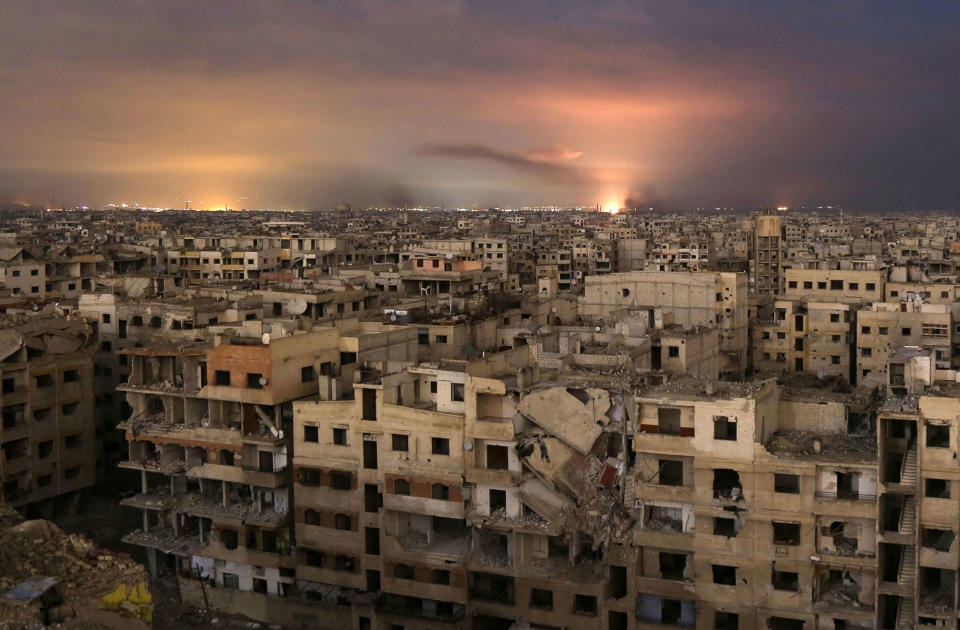 <p>Smoke billows following a regime air strike on the besieged eastern Ghouta region on the outskirts of the capital Damascus, late on Feb. 23, 2018. (Photo: Ammar Suleiman/AFP/Getty Images) </p>