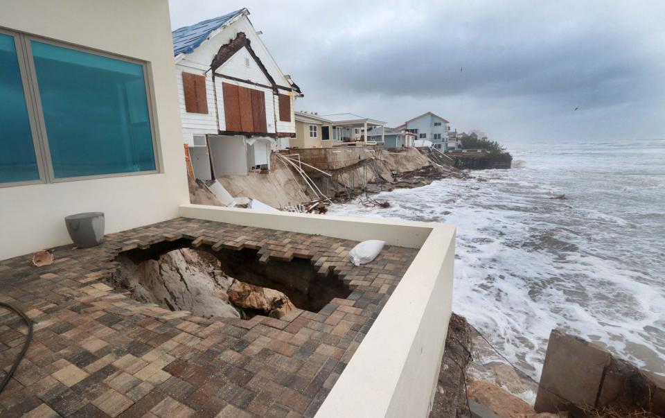 Some homes in Wilbur-by-the-Sea collapsed into the Atlantic Ocean on Thursday after being pounded by the rain, wind and surf generated by Tropical Storm Nicole. Seven homes were washed into the ocean, according to Volusia County Sheriff Mike Chitwood.