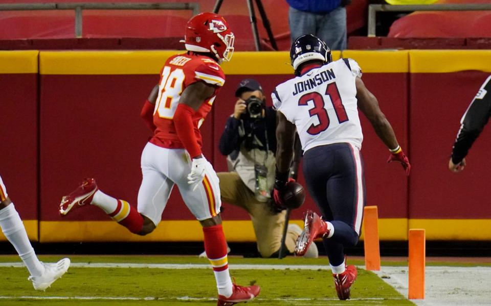 Houston Texans running back David Johnson (31) beats Kansas City Chiefs safety L'Jarius Sneed (38) to the end zone as Johnson scores a touchdown in the first half of an NFL football game Thursday, Sept. 10, 2020, in Kansas City, Mo. - AP