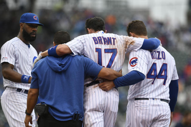 Chicago Cubs Kris Bryant falls throws to first for the final out