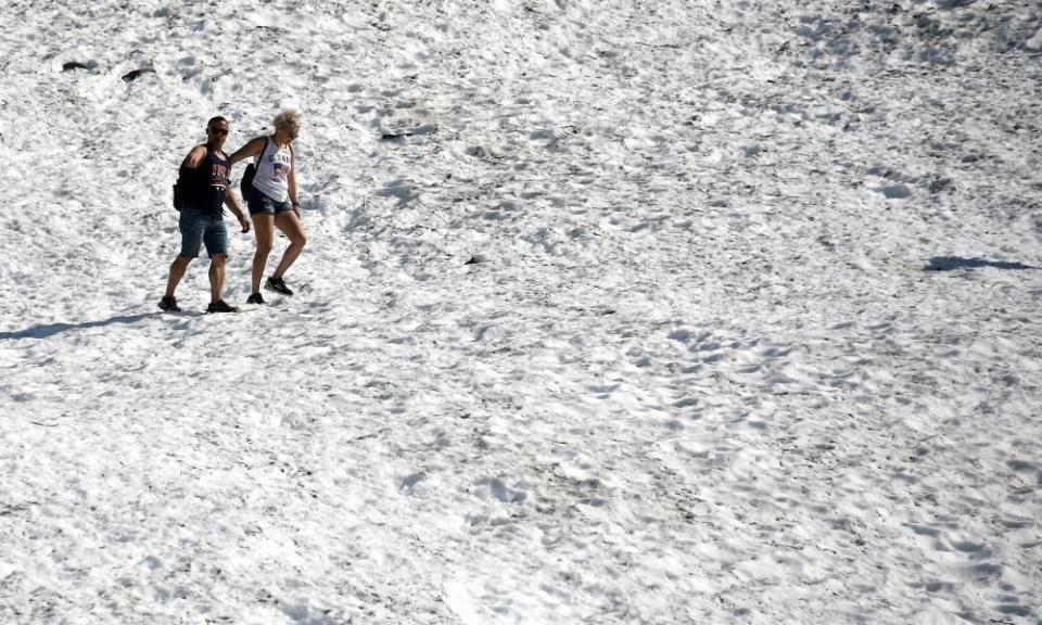 People hike near Portage Lake in Girdwood, Alaska, on 4 July.