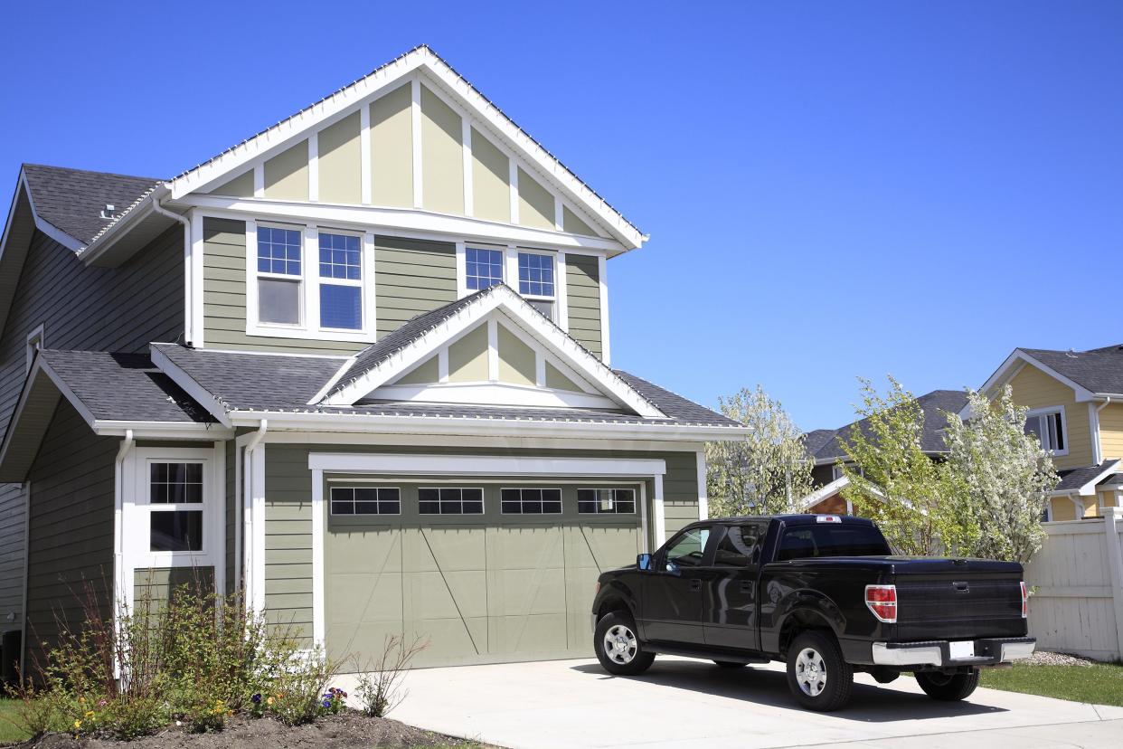 pickup truck in driveway of home