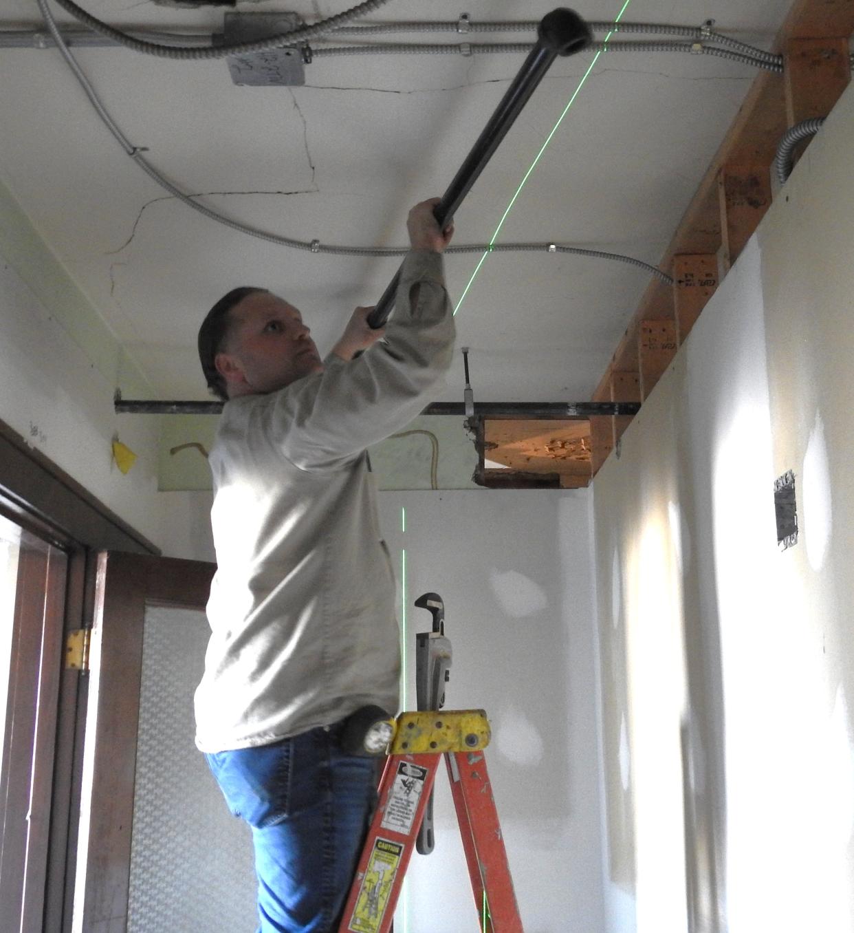 Beau Lonsinger of Philip A. Wagner does a pipe fitting at the Chacos Building as work is underway for the new Coshocton Collaborative. Currently being worked on are mechanical elements like plumbing, electrical and HVAC.