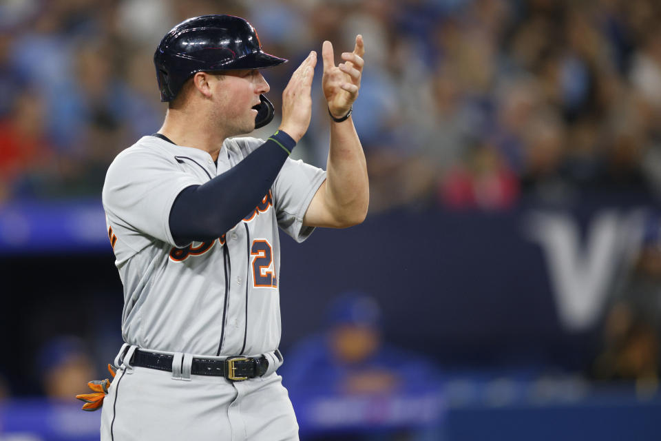 Detroit Tigers' Spencer Torkelson applauds after scoring on a Jake Rogers RBI-double in eighth-inning baseball game action against the Toronto Blue Jays in Toronto, Thursday, April 13, 2023. (Cole Burston/The Canadian Press via AP)