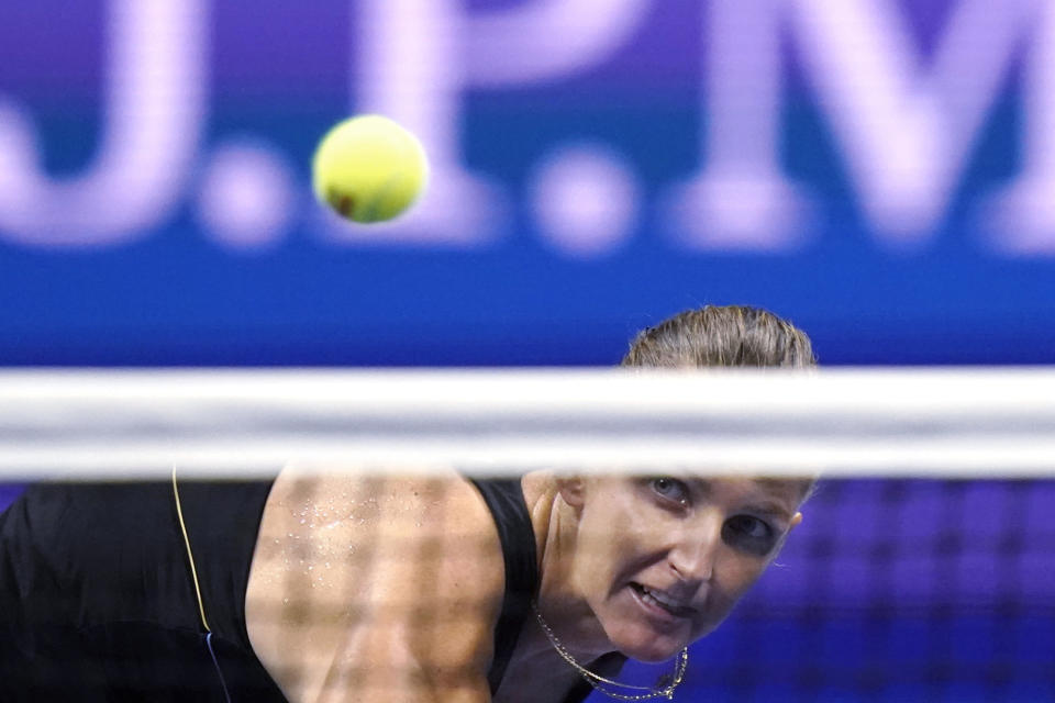 Karolina Pliskova, of the Czech Republic, eyes her return to Maria Sakkari, of Greece, during the quarterfinals of the U.S. Open tennis tournament Wednesday, Sept. 8, 2021, in New York. (AP Photo/Frank Franklin II)