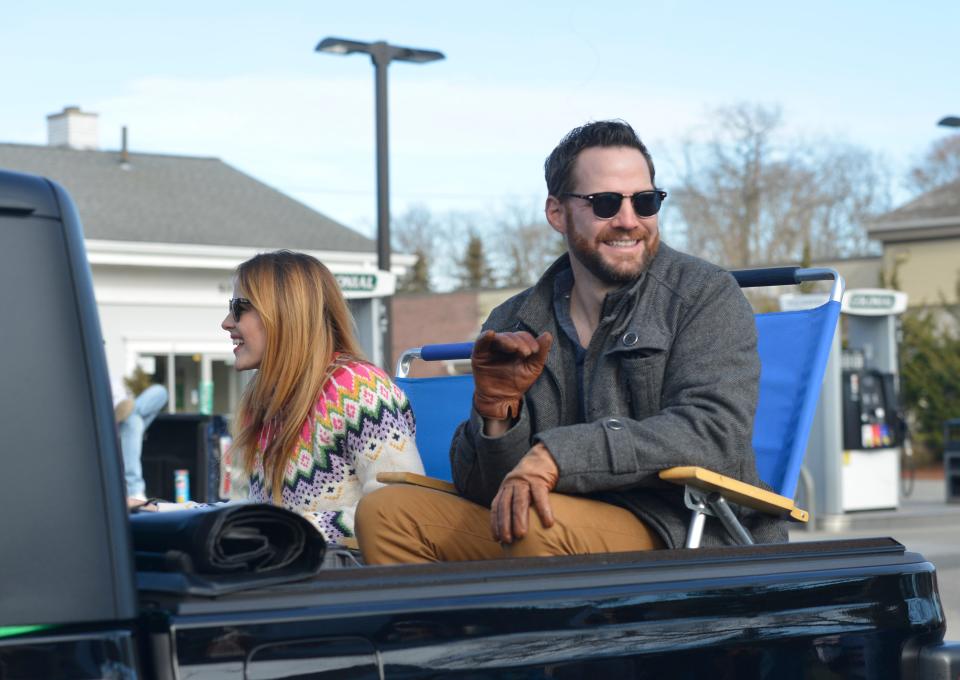 Actors Katie Leclerc and Brent Bailey, left to right, who starred in "A Cape Cod Christmas", participated in the 58th annual Falmouth Christmas Parade on Dec. 5, 2021.