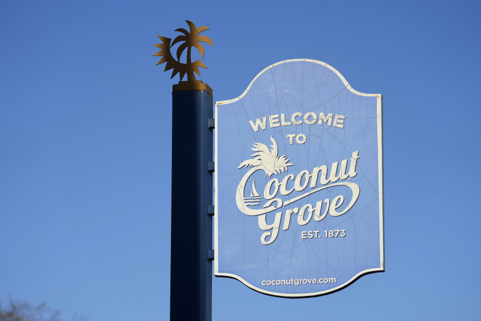 A street sign marks the Miami neighborhood of Coconut Grove, Thursday, Feb. 15, 2024. The majority-Black neighborhood — known by names such as West Grove, Black Grove, or even Little Bahamas, in a nod to its Bahamian roots — has nurtured the early careers of numerous notable sports figures. Years of economic neglect followed by recent gentrification have wiped out much of the neighborhood’s cultural backbone. (AP Photo/Lynne Sladky)