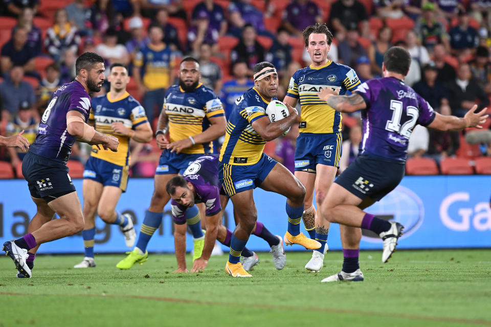 BRISBANE, AUSTRALIA - OCTOBER 03: Michael Jennings of the Eels makes a break during the NRL Qualifying Final match between the Melbourne Storm and the Parramatta Eels at Suncorp Stadium on October 03, 2020 in Brisbane, Australia. (Photo by Bradley Kanaris/Getty Images)