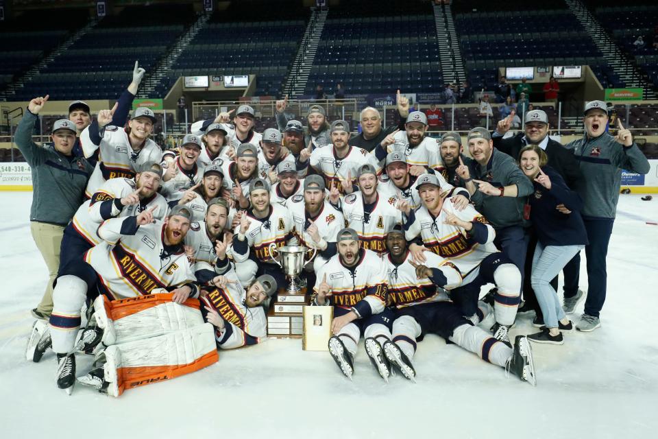 The Peoria Rivermen gather around the SPHL President's Cup in Berglund Center after beating Roanoke in Game 4 to win the championship series on May 3, 2022.
