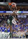 <p>Kansas guard Lagerald Vick (2) dunks the ball over Michigan State’ Joshua Langford (1) in the second half of a second-round game in the men’s NCAA college basketball tournament in Tulsa, Okla., Sunday, March 19, 2017. (AP Photo/Tony Gutierrez) </p>
