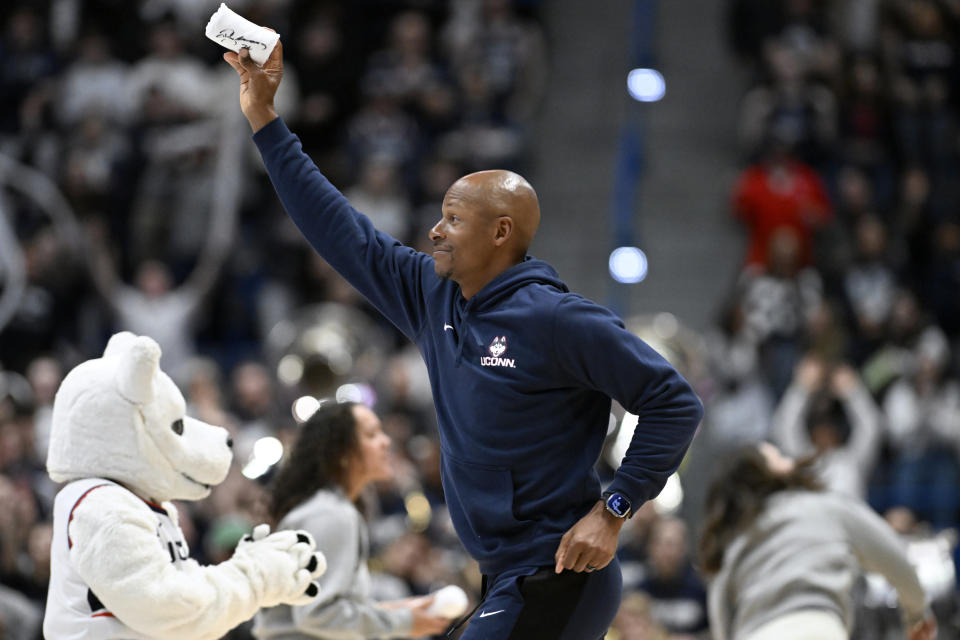 Ray Allen tosses shirts to fans during a an NCAA college basketball game between UConn and Georgetown, Sunday, Jan. 14, 2024, in Hartford, Conn. (AP Photo/Jessica Hill)