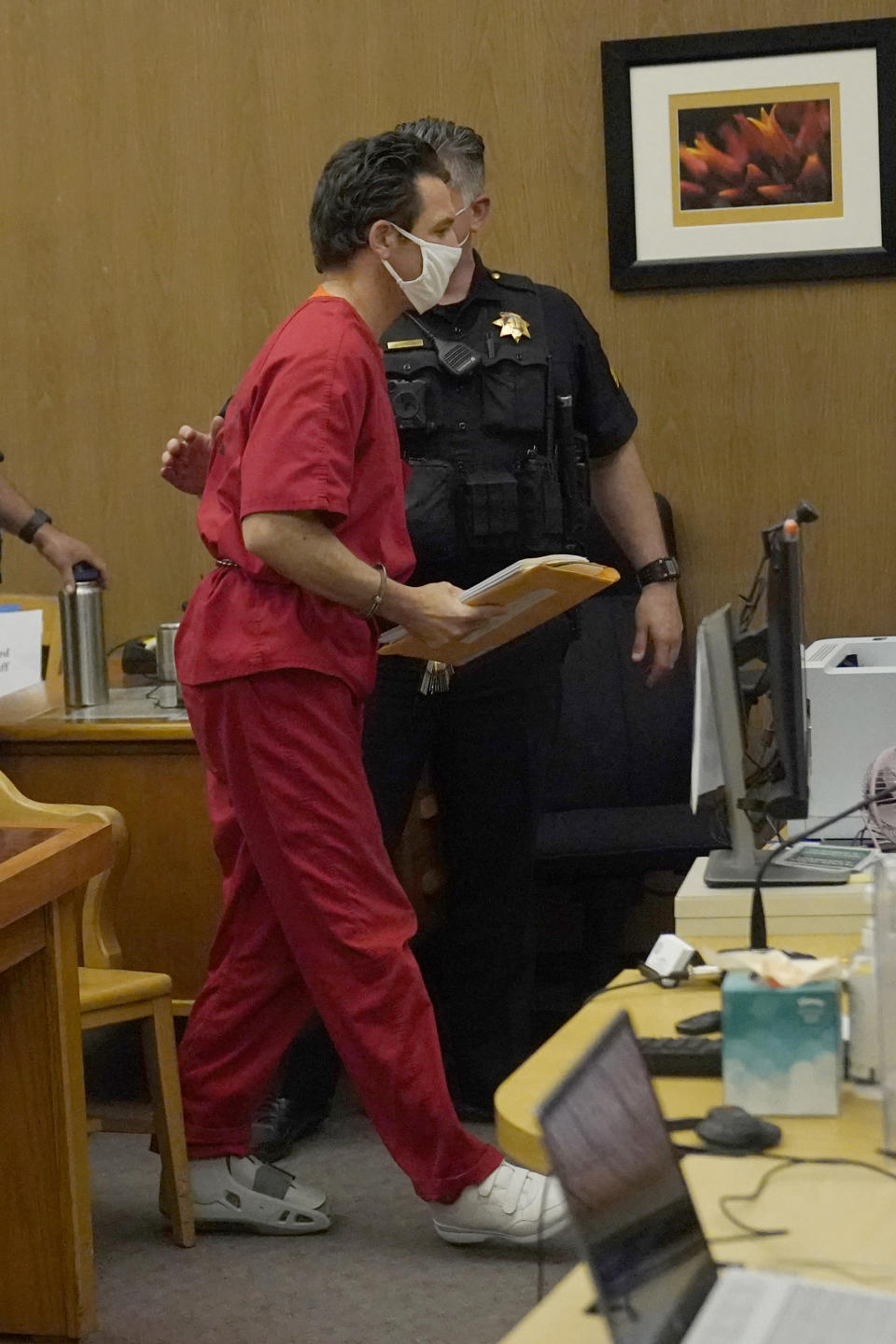 Scott Peterson walks out of court after a hearing at the San Mateo County Superior Court in Redwood City, Calif., Tuesday, March 1, 2022. Lawyers trying to overturn Peterson’s conviction in the slaying of his pregnant wife 20 years ago have completed their questioning without shaking a former juror. Richelle Nice is sticking to her crucial testimony that she acted properly before and during his 2004 trial. (AP Photo/Jeff Chiu, Pool)