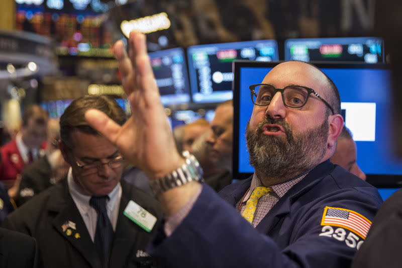 Traders work shortly after the opening bell on the floor of the New York Stock Exchange May 21, 2015. REUTERS/Lucas Jackson