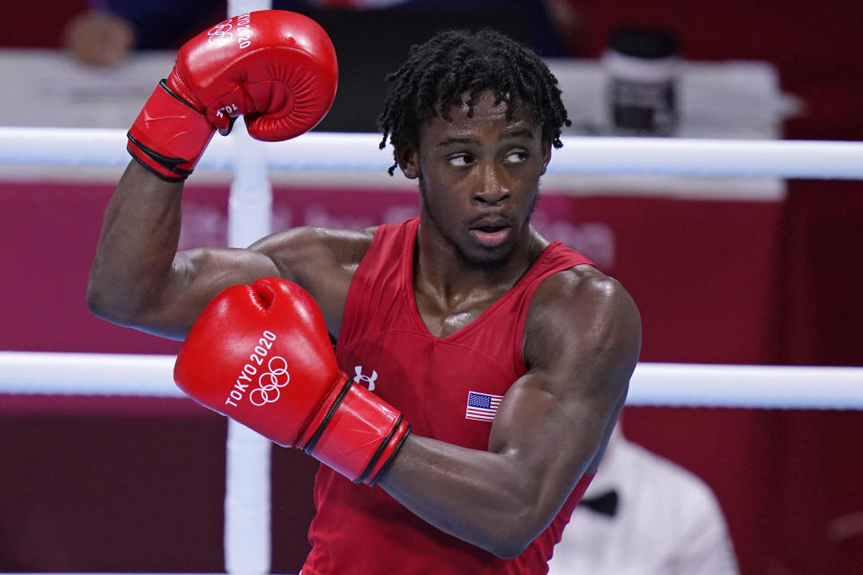 The United States' Keyshawn Davis celebrates after winning a men's lightweight 63-kg quarterfinal boxing match against Russian Olympic Committee's Gabil Mamedov at the 2020 Summer Olympics, Tuesday, Aug. 3, 2021, in Tokyo, Japan. (AP Photo/Frank Franklin II)