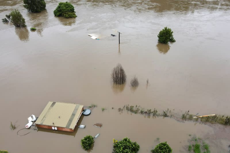 Drone picture of orange orchards and houses that are submerged near Hawkesbury River in northwestern Sydney