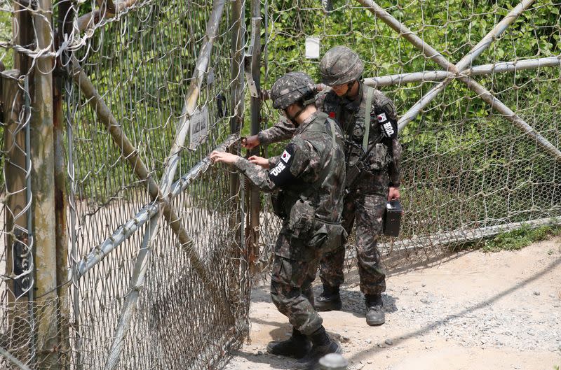 South Korean soldiers lock a gate at a guard post near the the demilitarized zone (DMZ) separating the two Koreas, in Paju, South Korea