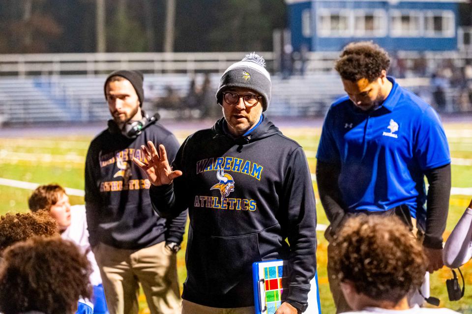 Wareham coach Christopher Gardner speaks to the team at half time, holding a 16-6 lead over Seekonk.