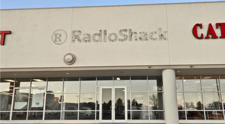 An empty retail location shows the remains of having formerly been a RadioShack.