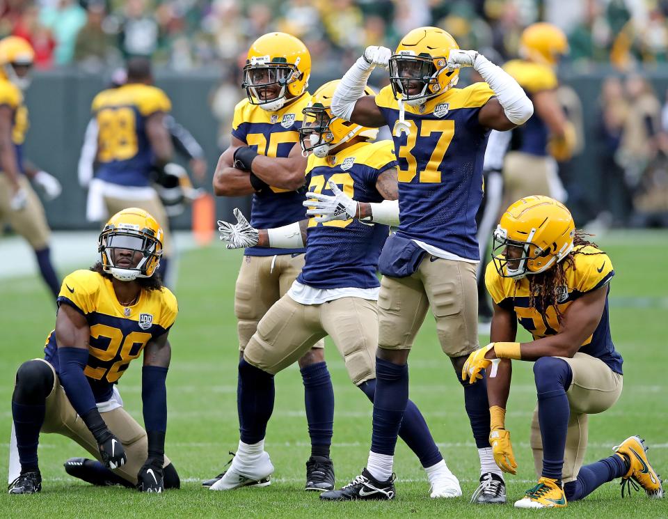 Green Bay Packers cornerback Jaire Alexander (23) and the rest of the defensive backfield celebrates his interception against the Buffalo Bills Sunday September 30, 2018 at Lambeau Field in Green Bay, Wis.