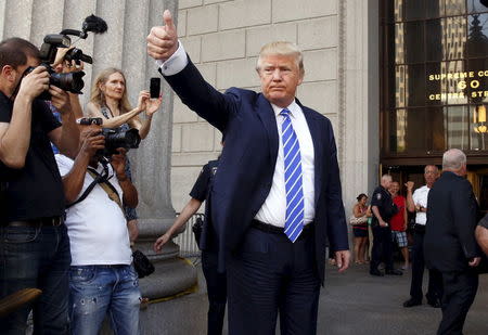 U.S. Republican presidential candidate Donald Trump gestures after arriving for jury duty at Manhattan Supreme Court in New York August 17, 2015. REUTERS/Lucas Jackson