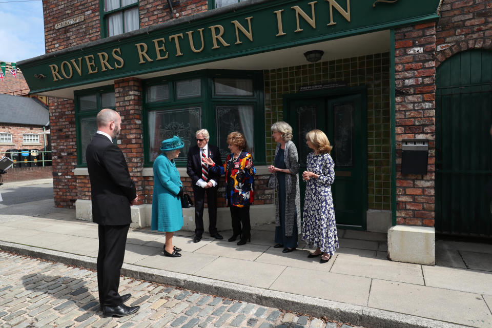 Queen Elizabeth II meets actors (left to right)William Roache, Barbara Knox, Sue Nicholls and Helen Worth, during a visit to the set of Coronation Street at the ITV Studios, Media City UK, Manchester. Picture date: Thursday July 8, 2021.