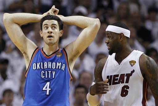 Oklahoma City Thunder power forward Nick Collison (4) and Miami Heat small forward LeBron James (6) react during the second half at Game 3 of the NBA Finals basketball series, Sunday, June 17, 2012, in Miami. The Heat won 91-85. (AP Photo/Lynne Sladky)