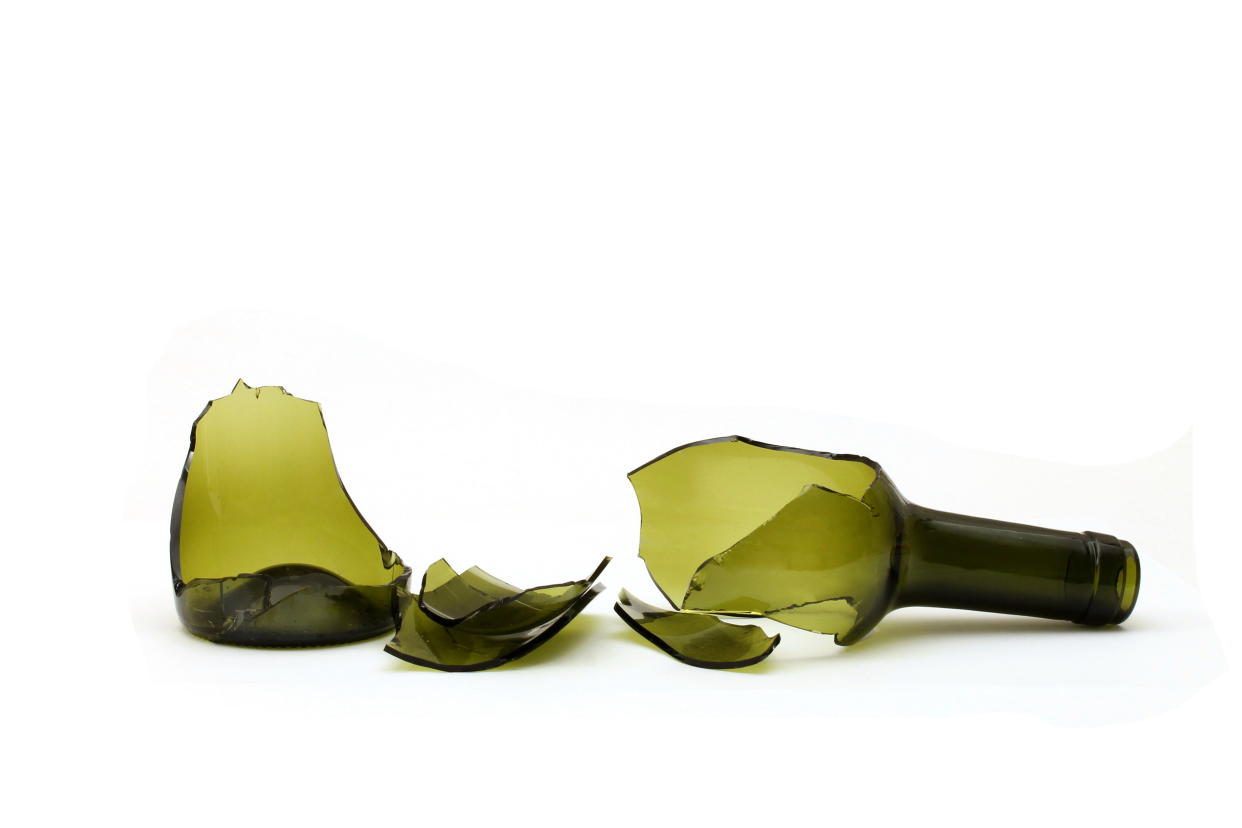 broken wine bottle on white background