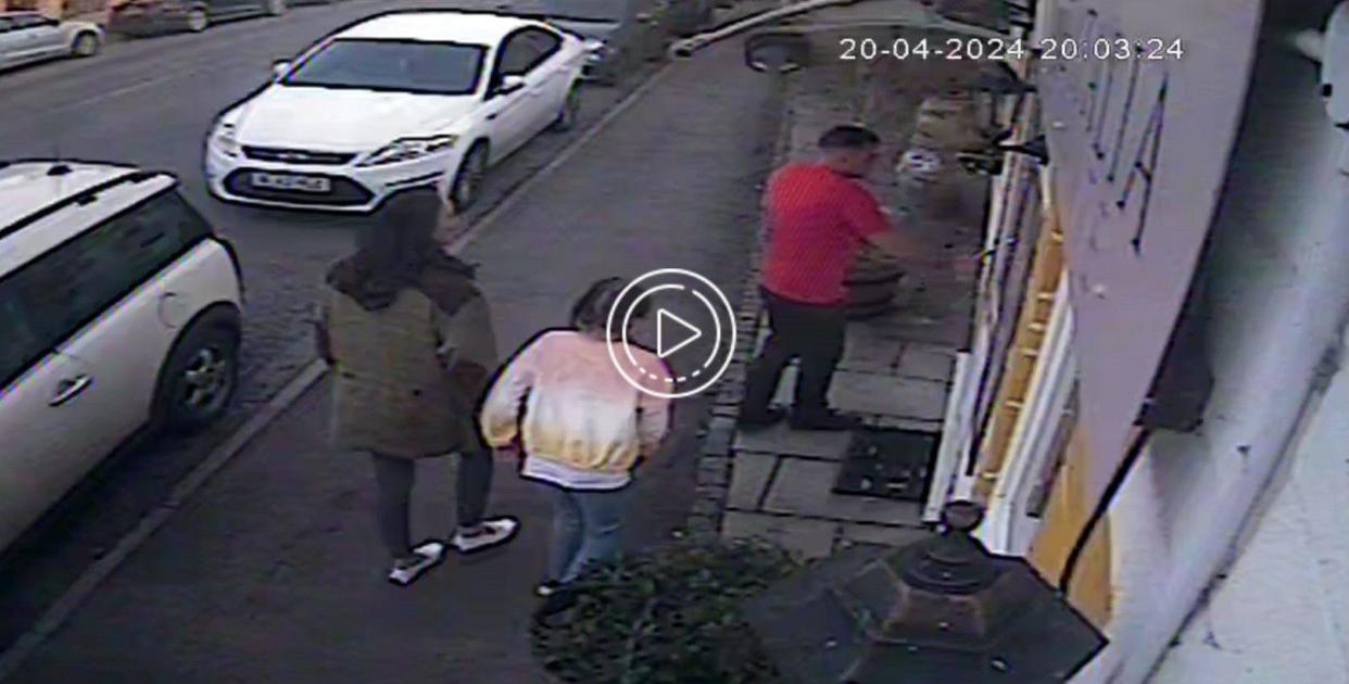 CCTV of family entering restaurant 