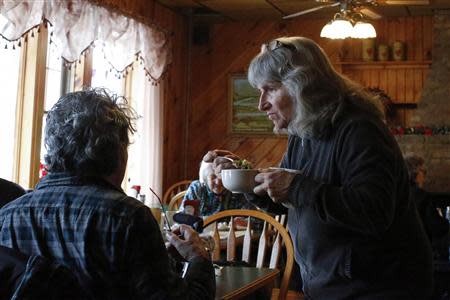 Anti-fracking activist Vera Scroggins (R) speaks with a friend inside a restaurant in Montrose, Pennsylvania, March 24, 2014. REUTERS/Eduardo Munoz