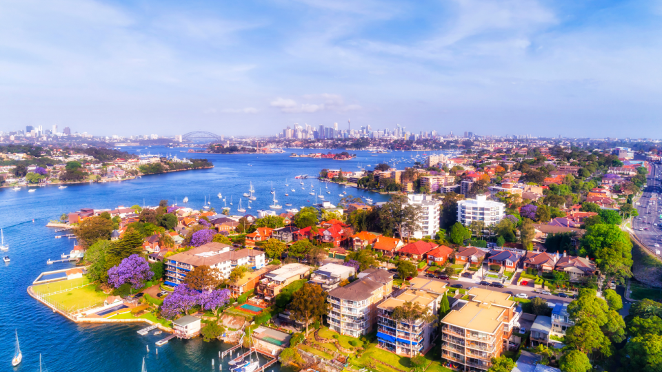 Property: Aerial view of a Sydney suburb with apartment blocks located right on the coastal line.