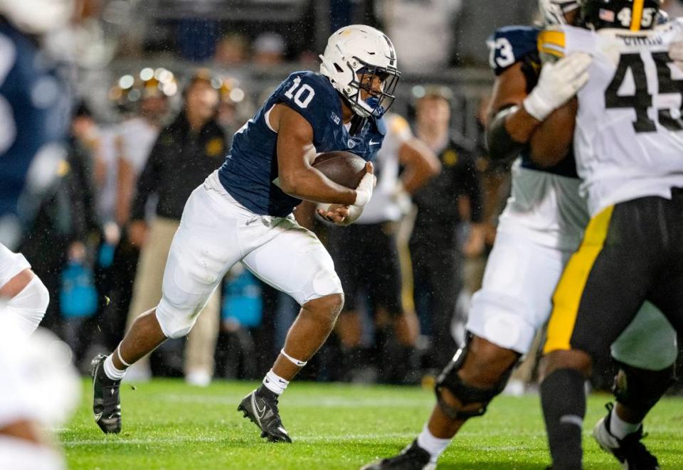 Penn State running back Nick Singleton cuts down the field with the ball during the game against Iowa on Saturday, Sept. 23, 2023.