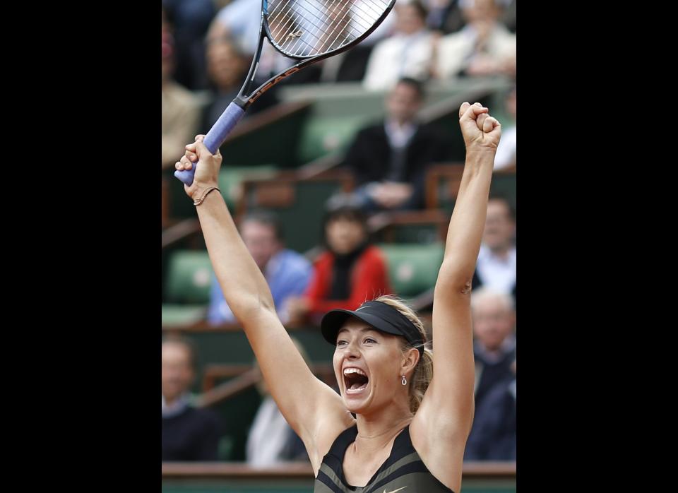 Russia's Maria Sharapova reacts as she defeats Estonia's Kaia Kanepi during their quarterfinal match in the French Open tennis tournament at the Roland Garros stadium in Paris. Sharapova wins 6-2, 6-3.     (AP Photo/Bernat Armangue)