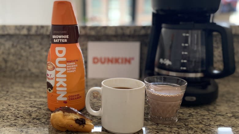 Dunkin' creamer with donut and coffee