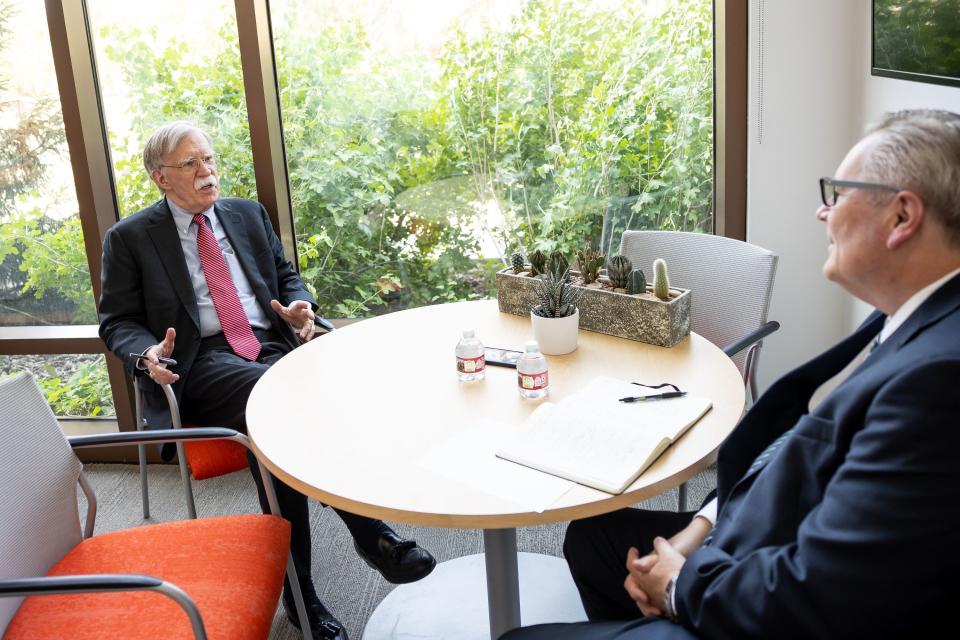 John Bolton, left, former national security adviser and U.S. Ambassador to the United Nations, sits for an interview with Doug Wilks, executive editor of the Deseret News.