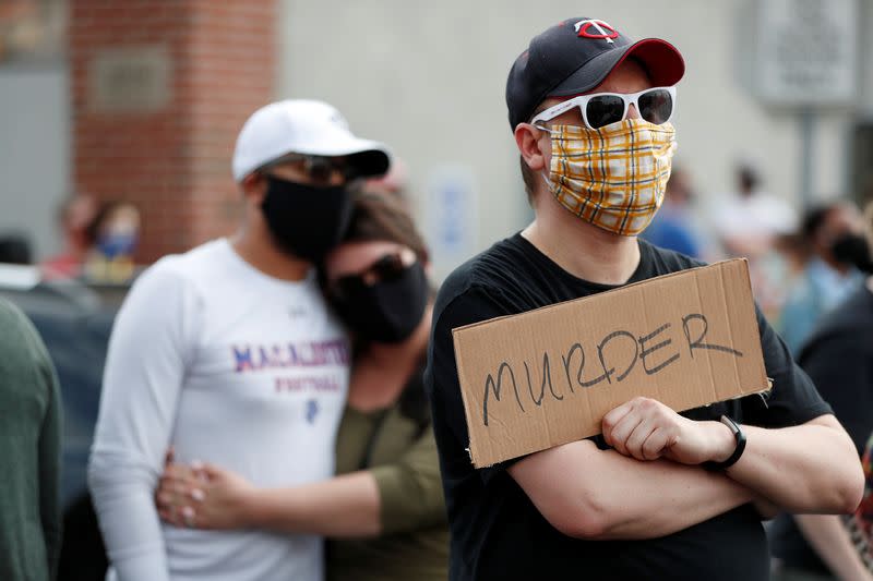 Protesters gather at the scene where Floyd was pinned down by a police officer in Minneapolis