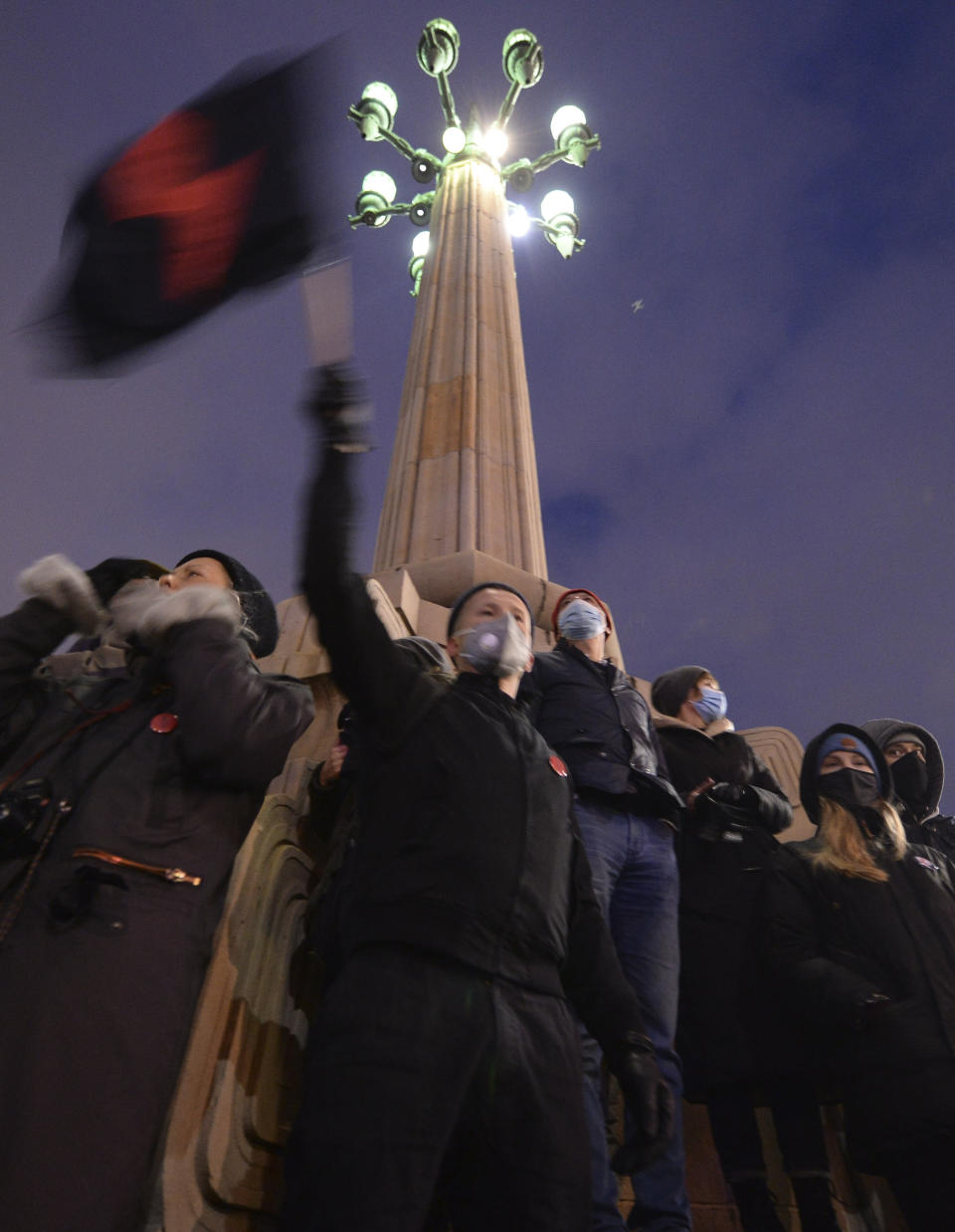 People demonstrate against police violence and an attempted restriction on abortion rights in Warsaw Poland, Saturday, Nov. 28, 2020. Nationwide protests Saturday were scheduled to coincide with Polish women gaining the right to vote 102 years ago. Weeks of protests against a high court's ruling to further restrict Abortion rights have evolved into the largest protest movement since communism fell 30 years ago.(AP Photo/Czarek Sokolowski)