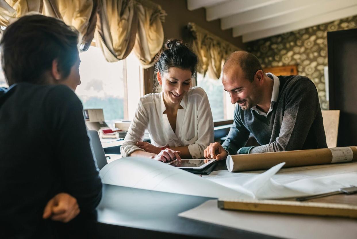 couple at table looking at plans