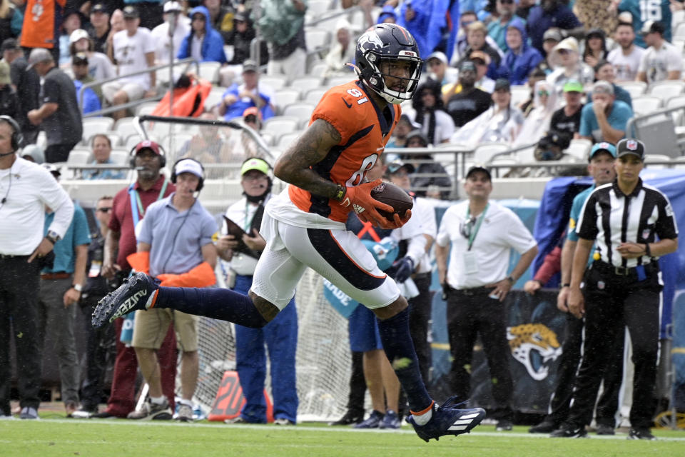 Denver Broncos wide receiver Tim Patrick (81) scores a touchdown on a 12-yard pass play against the Jacksonville Jaguars during the first half of an NFL football game, Sunday, Sept. 19, 2021, in Jacksonville, Fla. (AP Photo/Phelan M. Ebenhack)