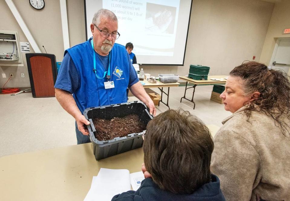 Master gardener Ted Hawkins shows MaryKate and Carol Cook of Oakdale the worm bin he assembled during a University of California Cooperative Extension class on raising worms to consume food scraps in Modesto, Calif., Thursday, Nov. 14, 2019. Andy Alfaro/aalfaro@modbee.com
