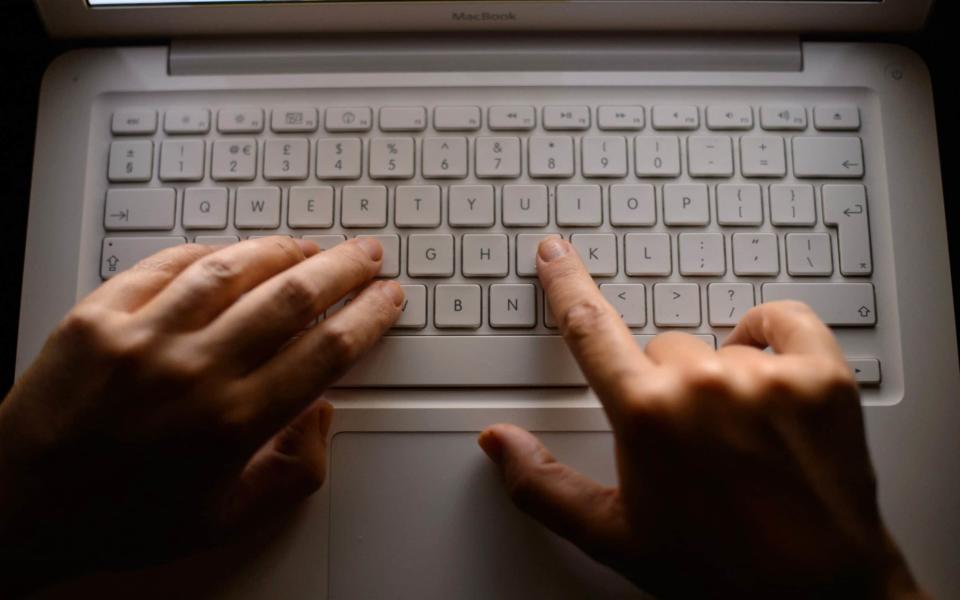 The latest cyber threat involves criminals using a mobile phone to eavesdrop on their victim's keyboard strokes - PA