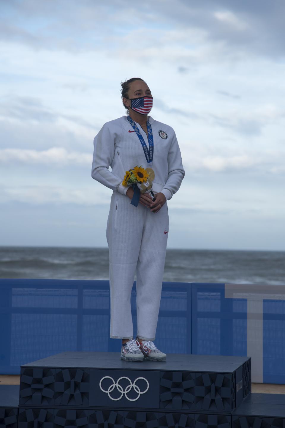 <p>ICHINOMIYA, JAPAN - JULY 27: Carissa Moore of Team United States, Gold medallist celebrates on the podium on day four of the Tokyo 2020 Olympic Games at Tsurigasaki Surfing Beach on July 27, 2021 in Ichinomiya, Chiba, Japan. (Photo by Olivier Morin - Pool/Getty Images)</p> 