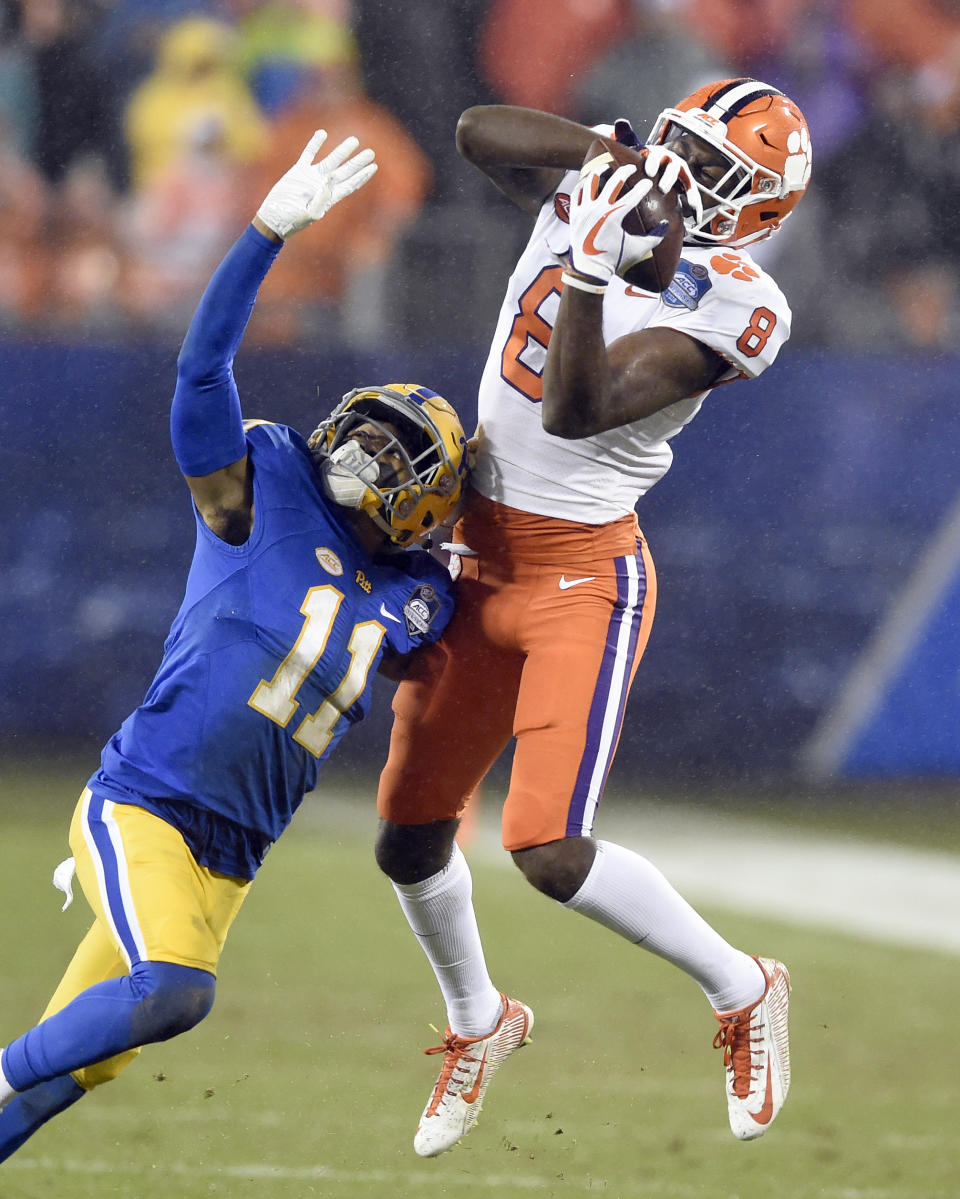 Clemson's Justyn Ross (8) catches a pass as Pittsburgh's Dane Jackson (11) defends in the first half of the Atlantic Coast Conference championship NCAA college football game in Charlotte, N.C., Saturday, Dec. 1, 2018. (AP Photo/Mike McCarn)