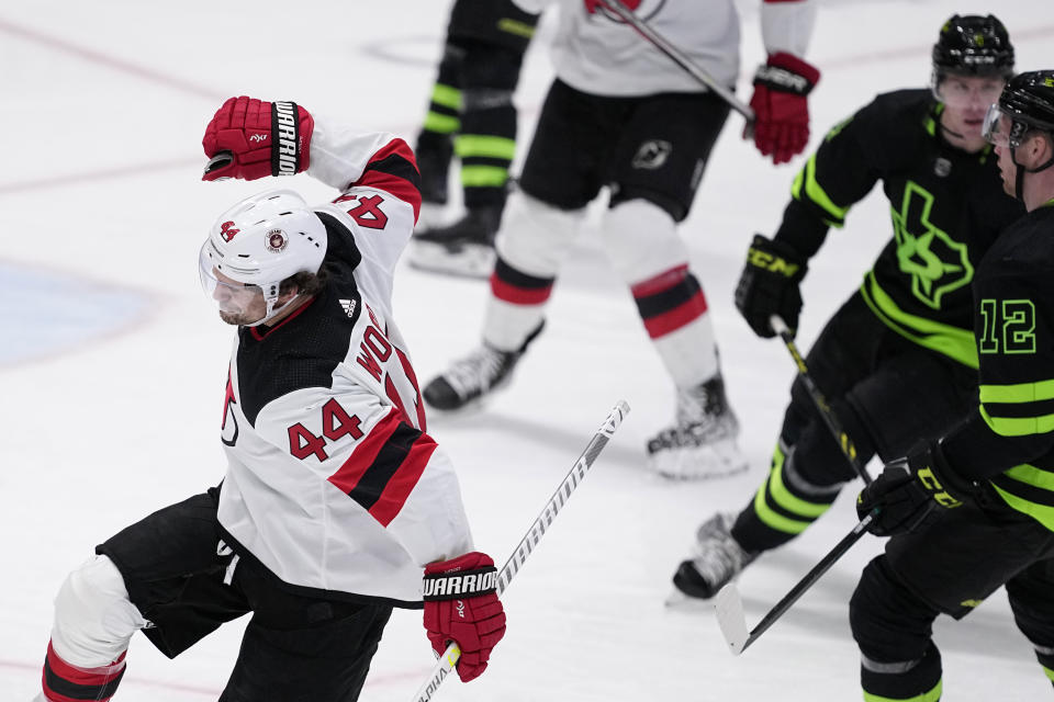 New Jersey Devils left wing Miles Wood (44) celebrates afer scoring in the second period of an NHL hockey game as Dallas Stars' Radek Faksa (12) looks on, Friday, Jan. 27, 2023, in Dallas. (AP Photo/Tony Gutierrez)