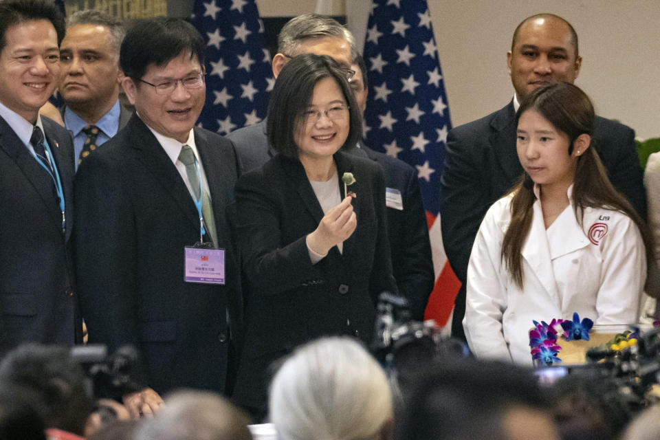 Taiwan's President Tsai Ing-wen, center, attends an event at the Taipei Economic and Cultural Office in New York, Thursday, March 30, 2023. (AP Photo/Yuki Iwamura)