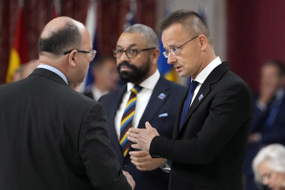 Hungary's Foreign Minister Peter Szijjarto, right, attends the meeting of NATO foreign ministers in Oslo, Norway, Thursday, June 1, 2023. (AP Photo/Sergei Grits)
