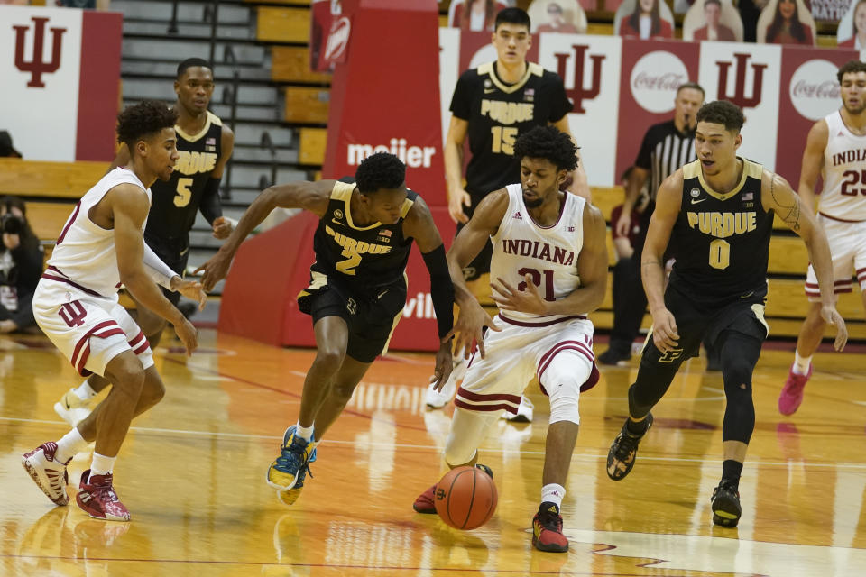 Purdue's Eric Hunter Jr. (2) and Indiana's Jerome Hunter (21) battle for the ball during the first half of an NCAA college basketball game, Thursday, Jan. 14, 2021, in Bloomington Ind. (AP Photo/Darron Cummings)